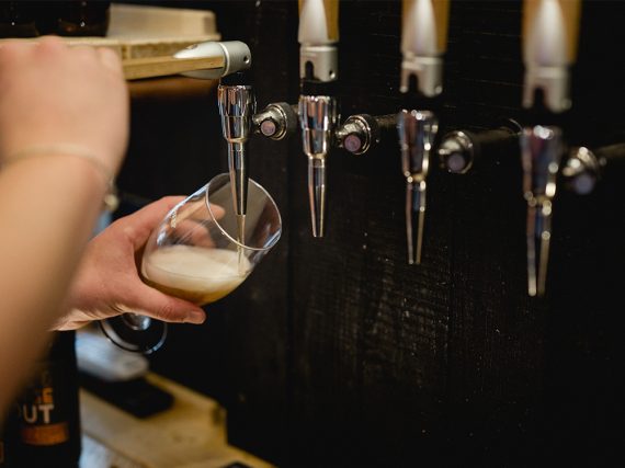 Kegs of Beer Being Poured